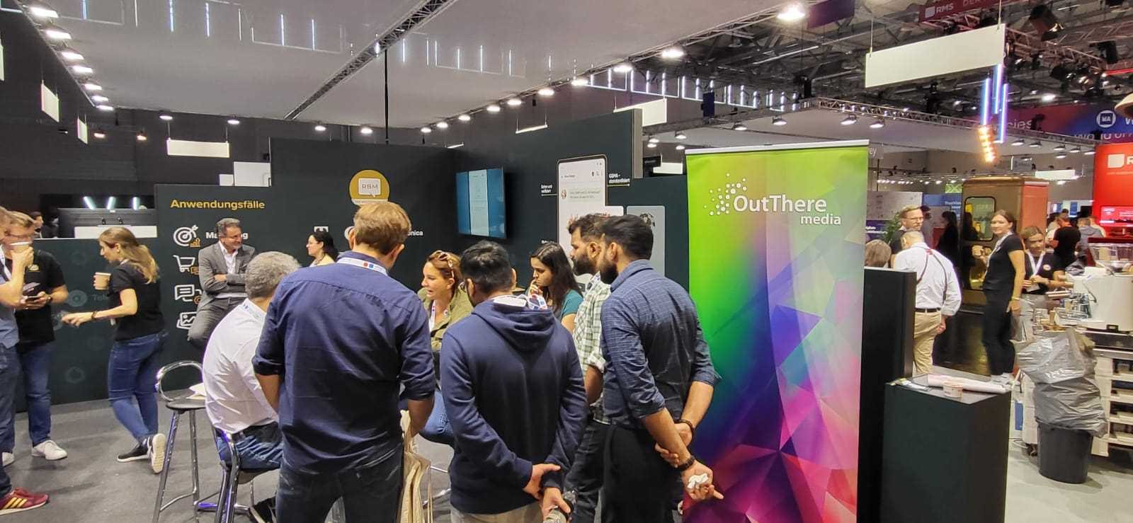 Visitors at the Out There Media stand at DMEXCO