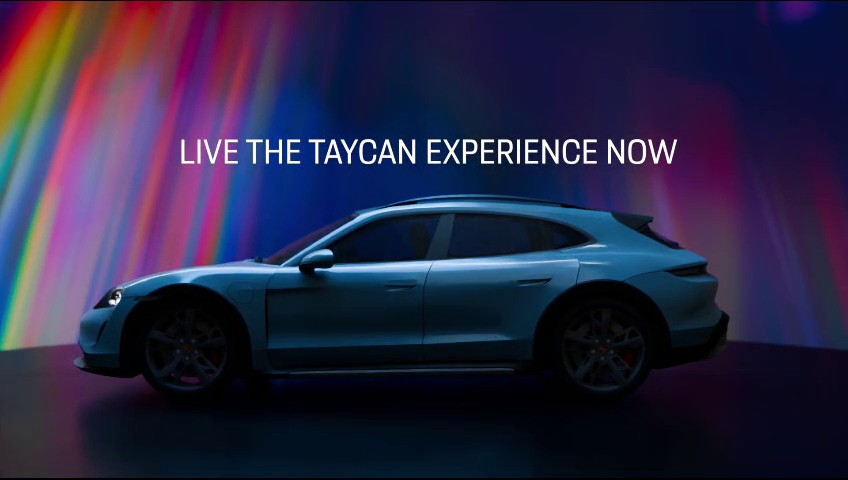 Porsche Taycan on a stage of coloured light